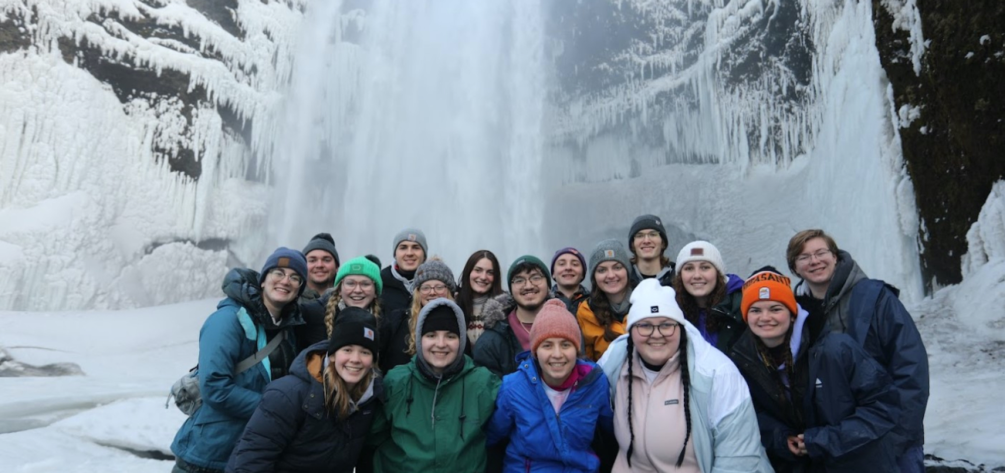 Group in front of waterfall