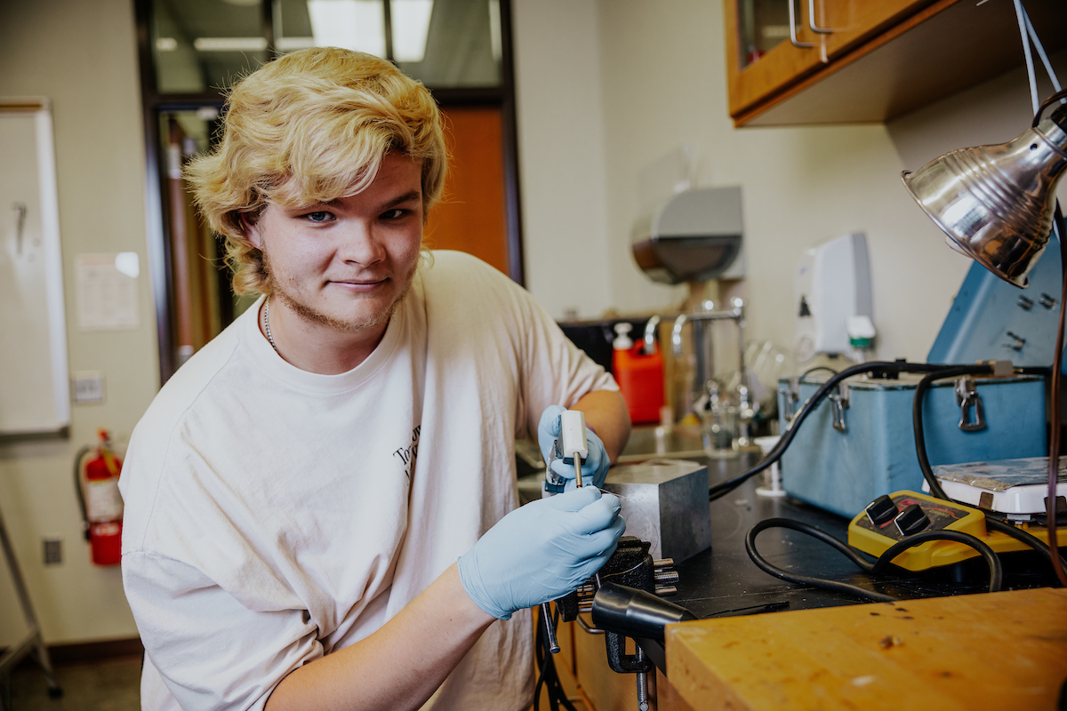 Engineering student engaging in hands-on learning