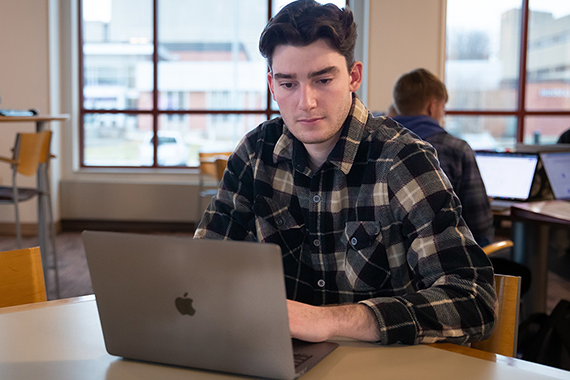 student working on a laptop
