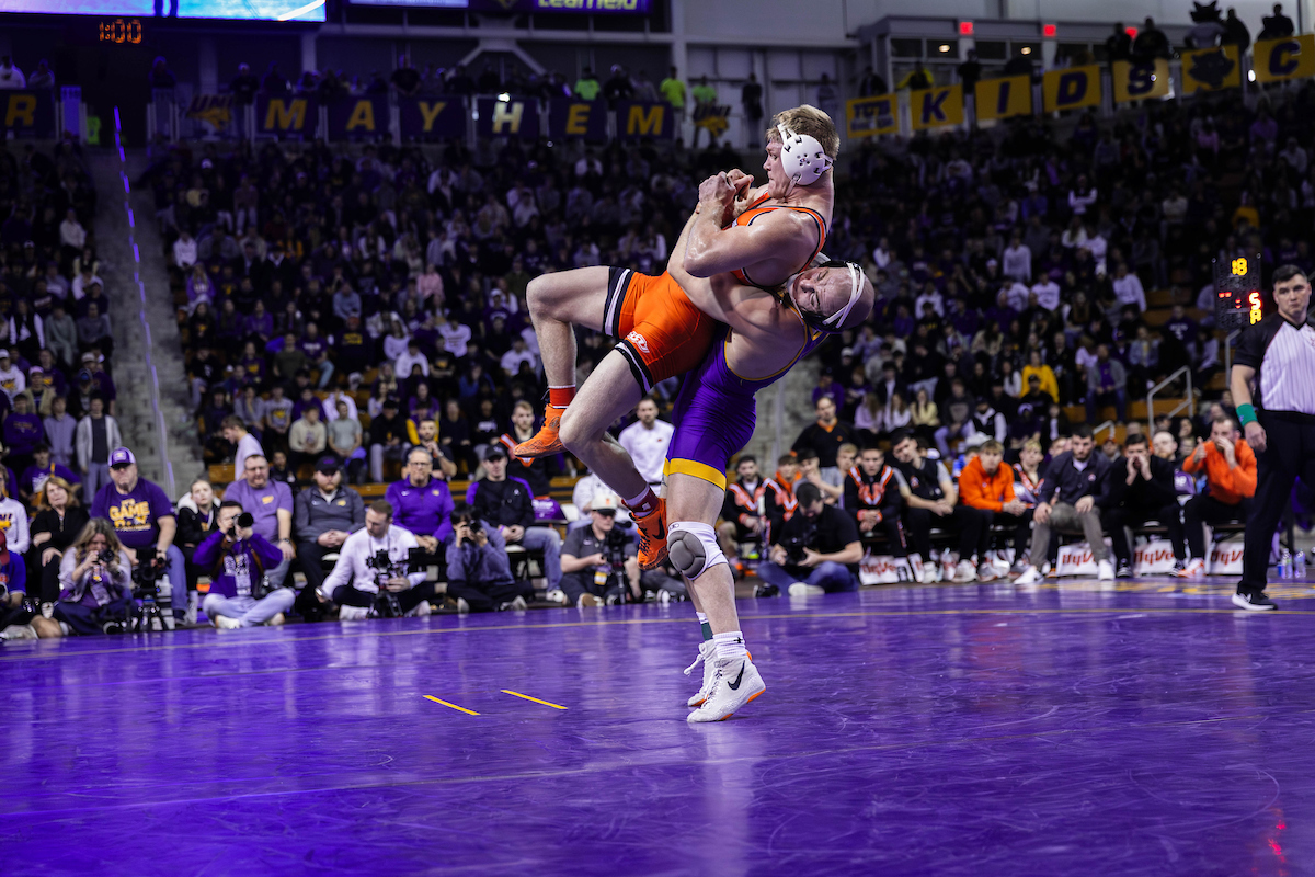 Parker Keckeisen lifting wrestling opponent on mat