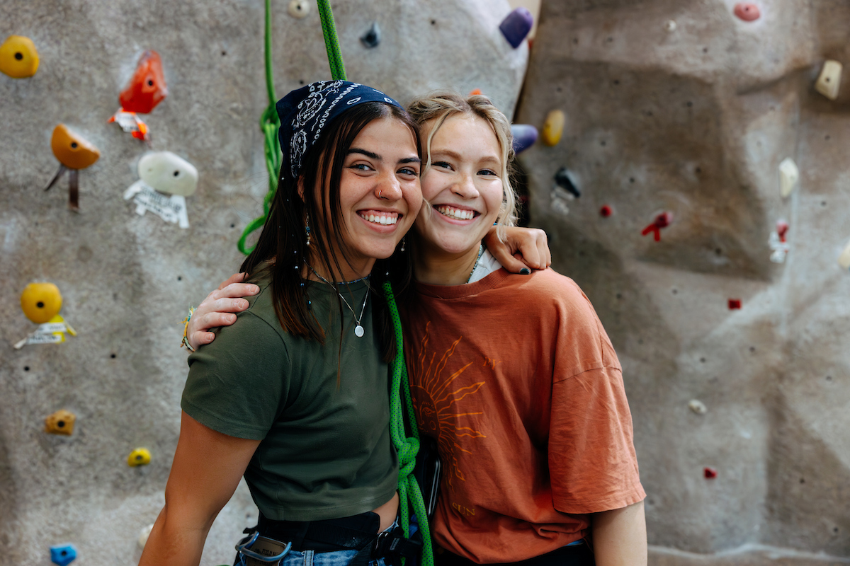 Two students about to rock climb