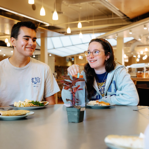 Students eat in dining center