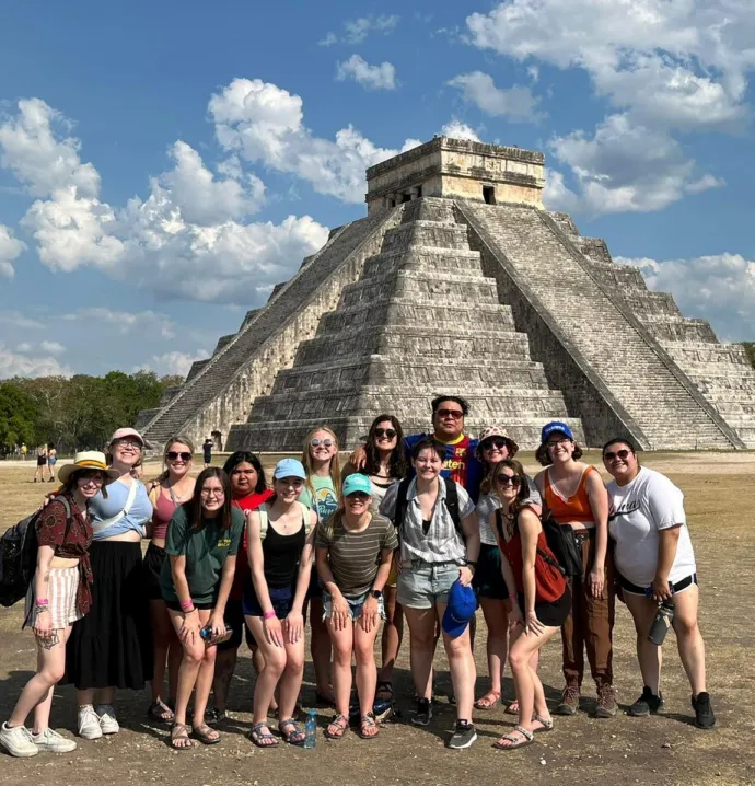 Group of students in front of Mayan structure